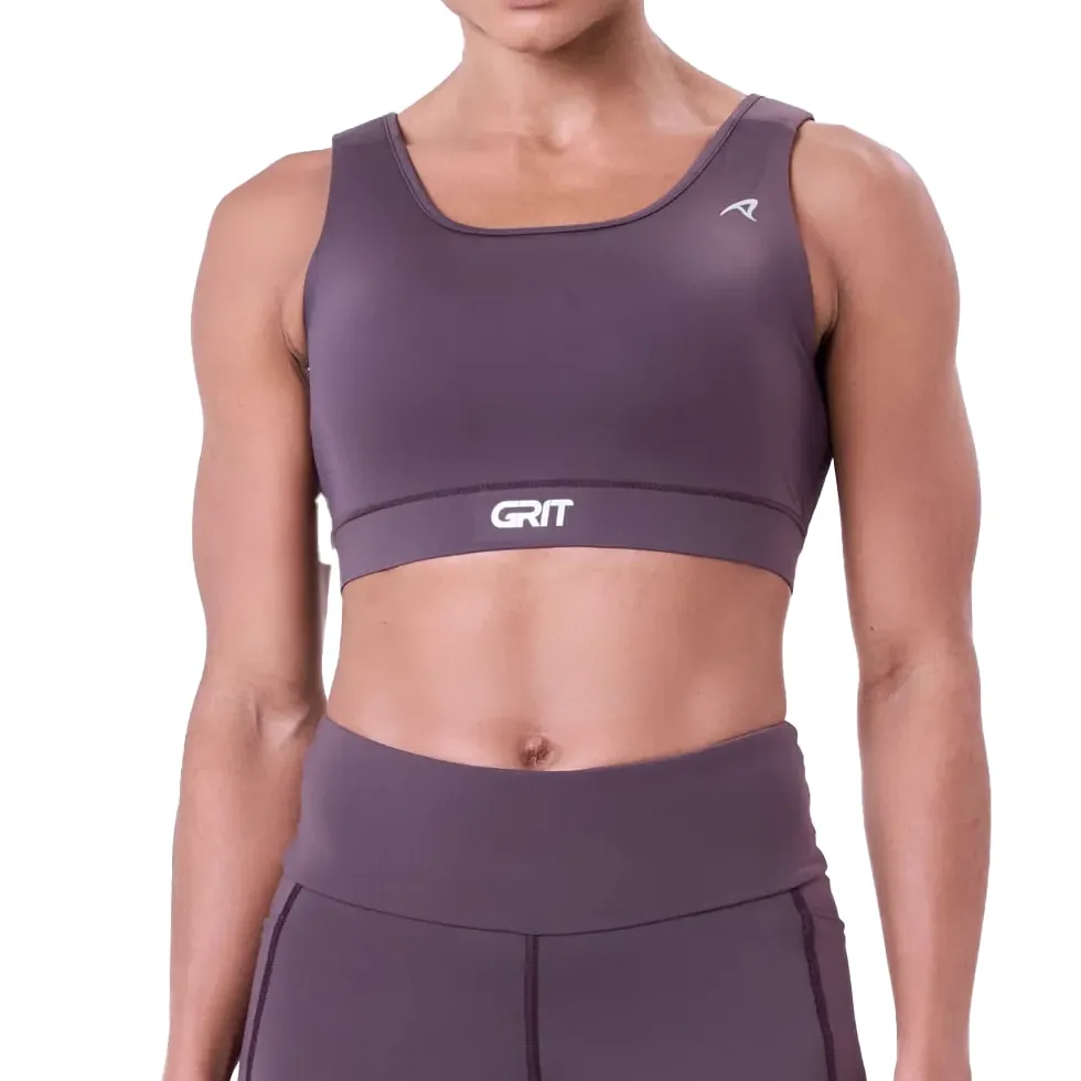 Mulher usando top esportivo roxo Authen com design nadador e alças acolchoadas ajustáveis